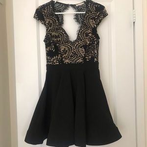 Black Open Back Dress by Chelsea.